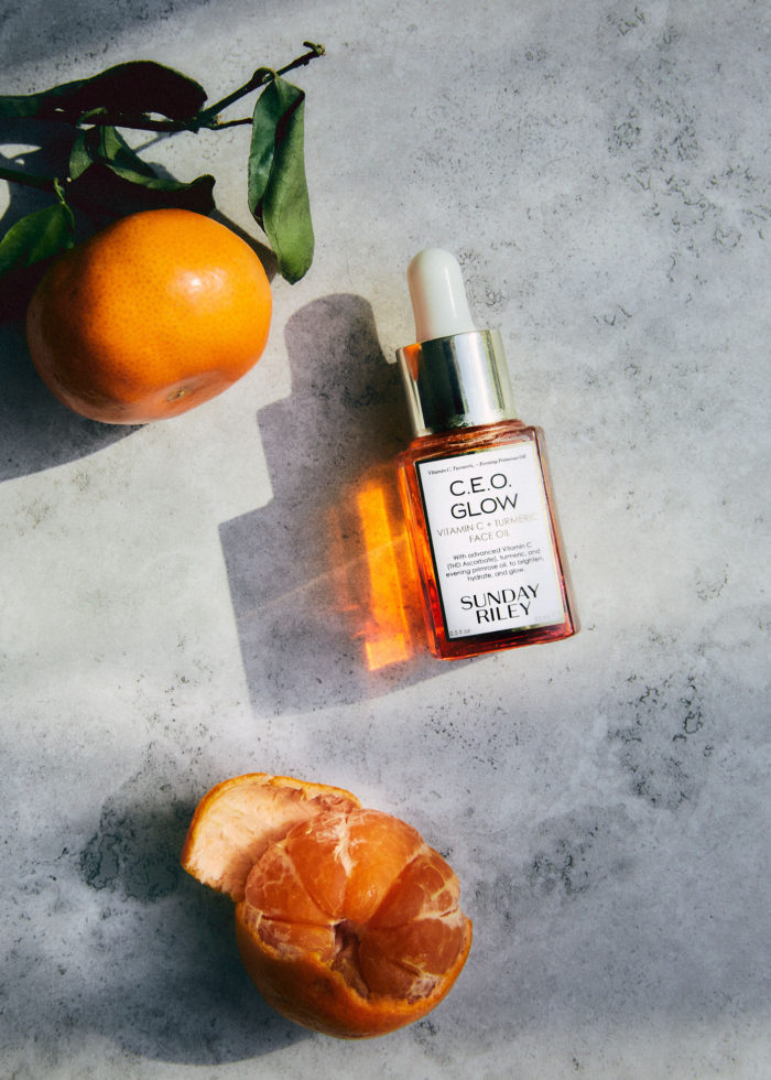 Product shoot with tangerine and face serum