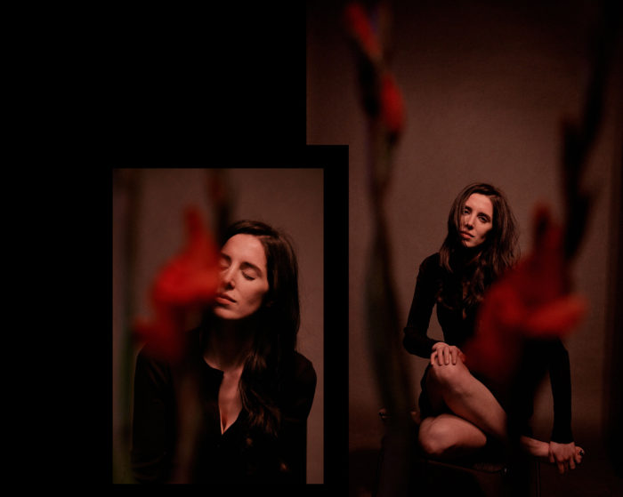 Portrait of woman in studio with flowers